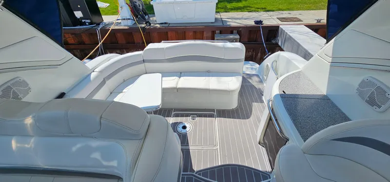 Slide: The Image of The image shows the cockpit of a 2007 Formula 37 Performance Cruiser with white cushioned seating and a table. - 14
