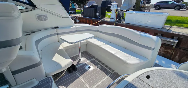 Slide: The Image of The 2007 Formula 37 Performance Cruiser features an elegant seating area with a small table. - 13