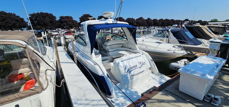 Slide: The Image of A 2007 Formula 37 Performance Cruiser docked, surrounded by other boats. - 8