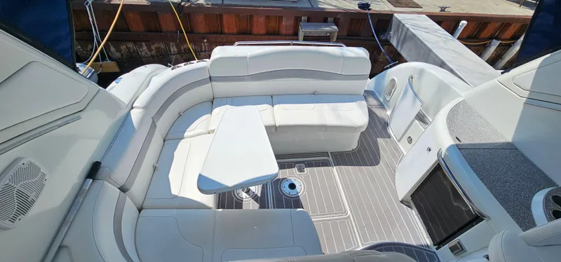 Slide: The Image of The image shows the cockpit of a 2007 Formula 37 Performance Cruiser with white cushioned seating and a table. - 26