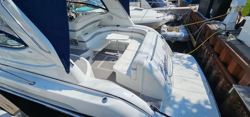 Slide: The Image of The image shows the stern of a white 2007 Formula 37 Performance Cruiser with seating area and table. - 10