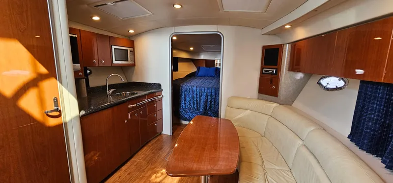 Slide: The Image of Interior of a 2007 Formula 37 Performance Cruiser with sleek kitchen and cozy living area. - 37
