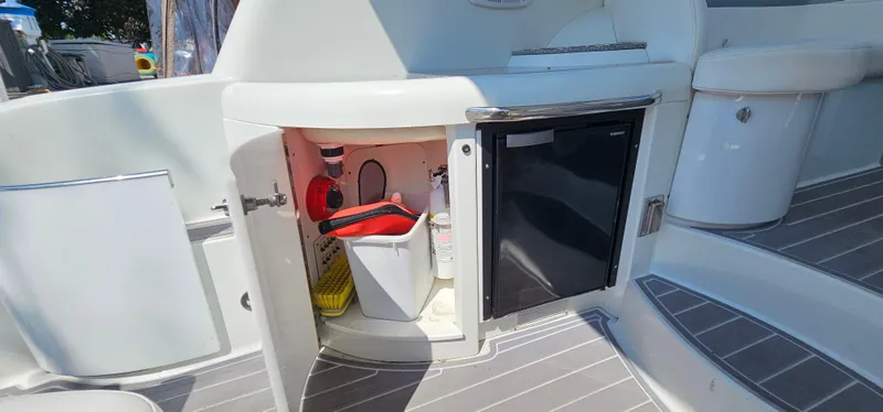 Slide: The Image of The image shows the exterior of a 2007 Formula 37 Performance Cruiser with a small fridge and storage. - 16