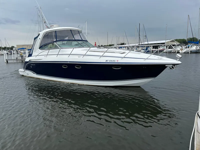 The Image of A 2007 Formula 37 Performance Cruiser on the water, surrounded by other boats in the harbor. - 1