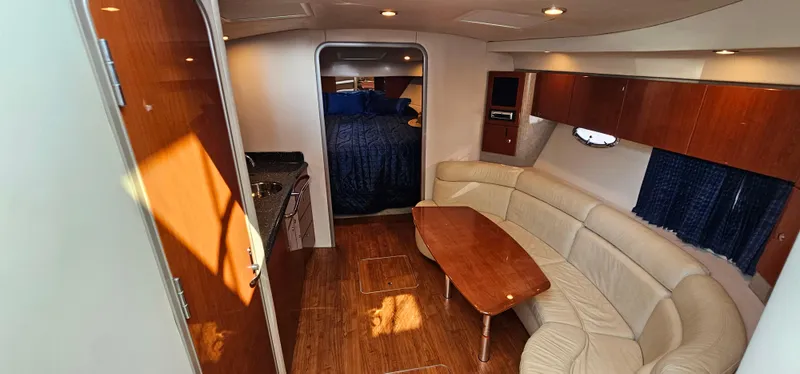 Slide: The Image of Interior of a 2007 Formula 37 Performance Cruiser with elegant leather seating and wooden table. - 31