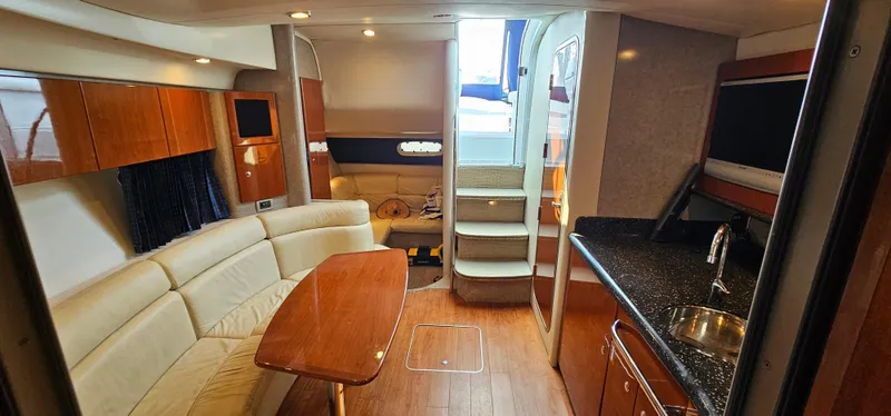 Slide: The Image of Interior of the 2007 Formula 37 Performance Cruiser with elegant seating area and kitchenette. - 36