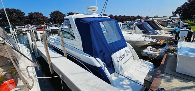 Slide: The Image of A 2007 Formula 37 Performance Cruiser docked in a busy marina. - 4