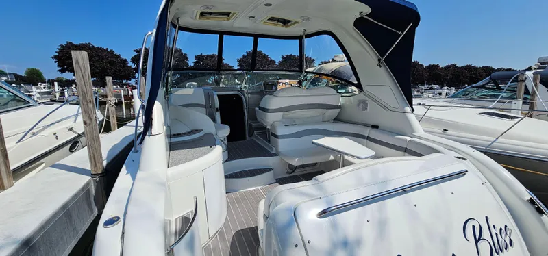 Slide: The Image of The image shows the cockpit of a 2007 Formula 37 Performance Cruiser with white seating and a table. - 11