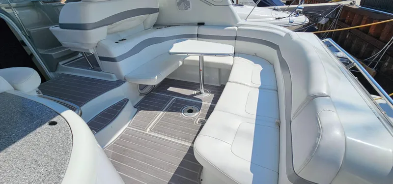 Slide: The Image of The image shows the cockpit of a 2007 Formula 37 Performance Cruiser with white upholstery and a small table. - 12