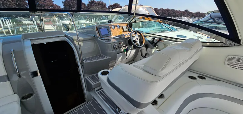 Slide: The Image of The image shows the cockpit of a 2007 Formula 37 Performance Cruiser with white upholstery and a modern dashboard. - 18