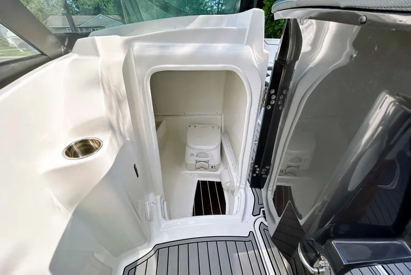 Slide: The Image of Interior of 2020 Monterey M-45 boat showing compact restroom with toilet. - 10
