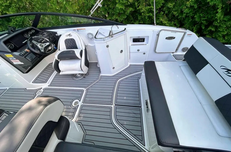 Slide: The Image of 2020 Monterey M-45 boat interior with sleek seating and modern dashboard design. - 13