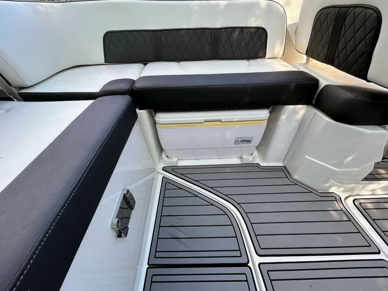 Slide: The Image of Interior seating of a 2020 Monterey M-45 boat with black and white upholstery. - 14