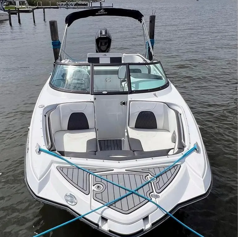 Slide: The Image of 2020 Monterey M-45 boat docked on calm water, featuring sleek design and comfortable seating. - 15