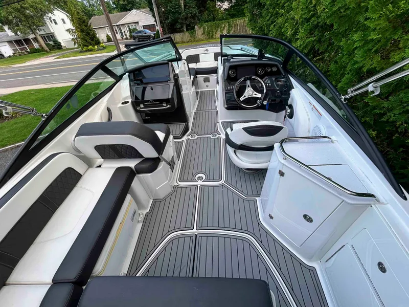 Slide: The Image of 2020 Monterey M-45 boat interior with sleek seating and modern dashboard design. - 2