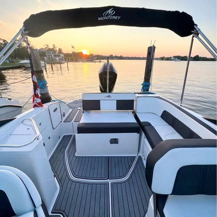 Slide: The Image of 2020 Monterey M-45 boat interior at sunset, featuring sleek seating and elegant design. - 5