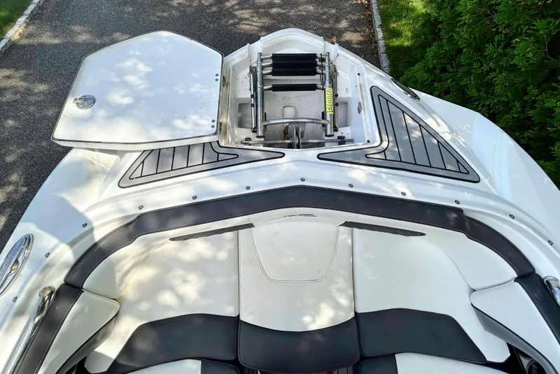 Slide: The Image of 2020 Monterey M-45 boat with open storage compartment and sleek seating design. - 9