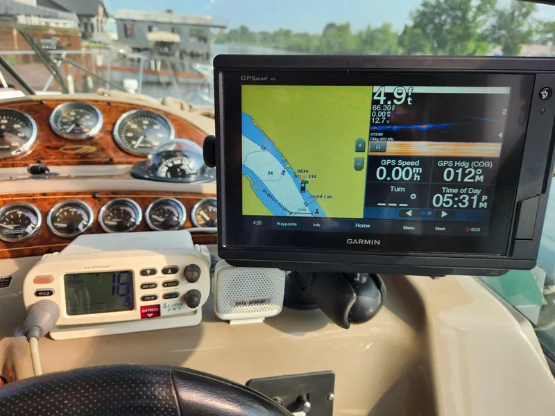 Slide: The Image of Boat dashboard with Garmin GPS, Maxum 3300 SCR, 2001 model, showing navigation and speed data. - 13