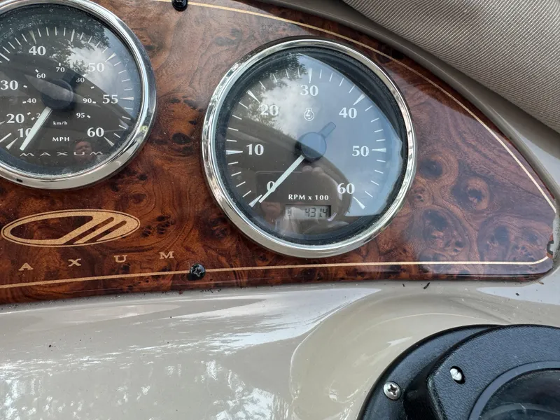 Slide: The Image of Dashboard of a 2001 Maxum 3300 SCR boat with speedometer and tachometer. - 15