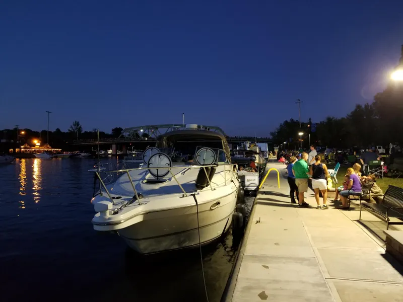 Slide: The Image of 2001 Maxum 3300 SCR docked at night with people gathered on the pier. - 33