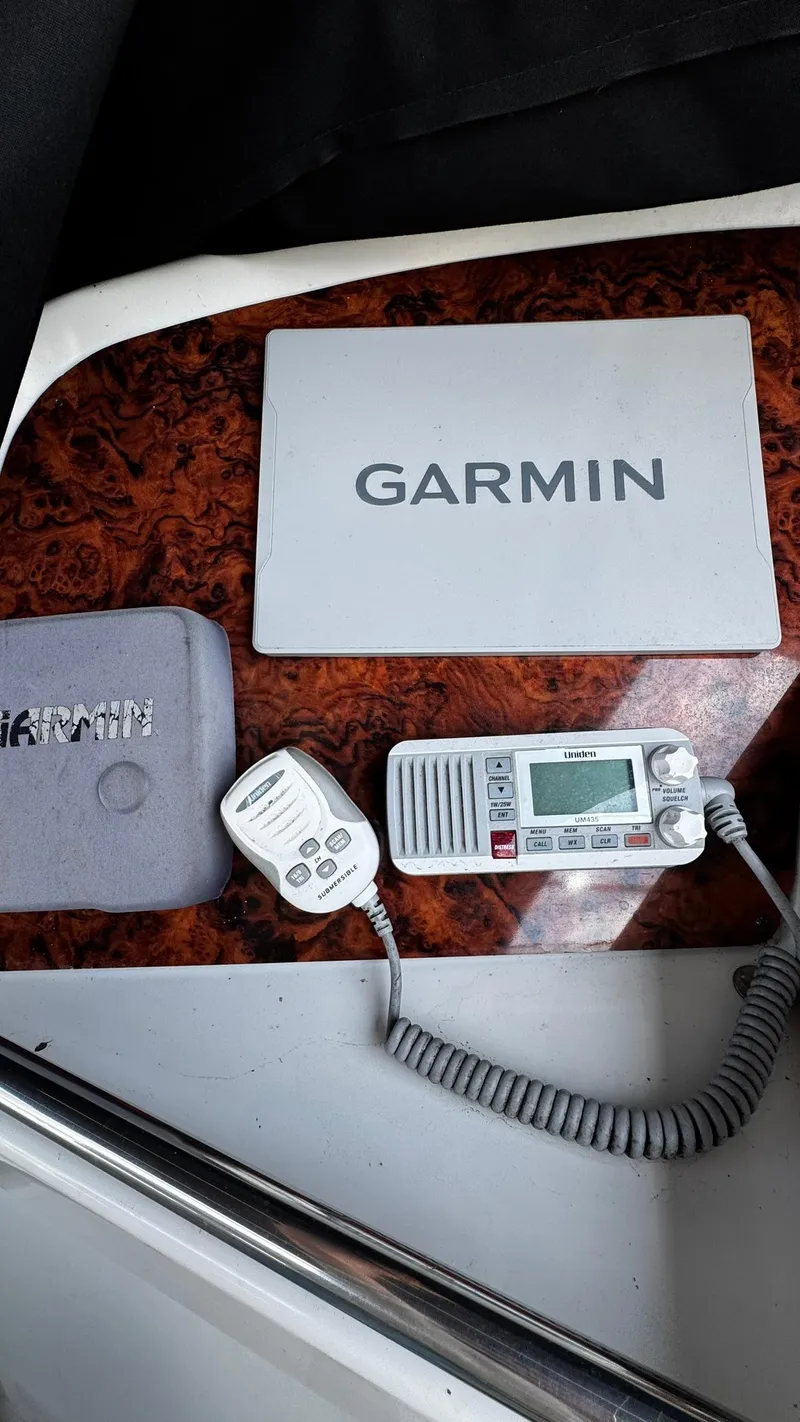 Slide: The Image of Garmin navigation equipment on a 1999 Trojan 40 Express boat dashboard. - 3