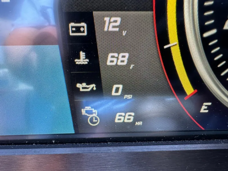 Slide: The Image of 2021 Centurion Fi25 dashboard display showing battery voltage, temperature, oil pressure, and engine hours. - 4