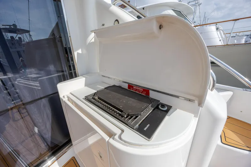 Slide: The Image of Outdoor grill on 2004 Neptunus 56 Flybridge yacht, featuring sleek design and modern amenities. - 15