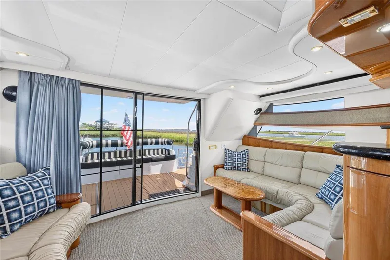 Slide: The Image of Luxurious interior of 2004 Neptunus 56 Flybridge yacht with elegant seating and scenic views. - 28