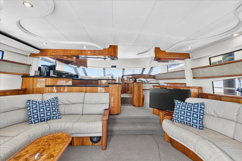 Slide: The Image of Luxurious interior of 2004 Neptunus 56 Flybridge yacht with elegant seating and modern amenities. - 29