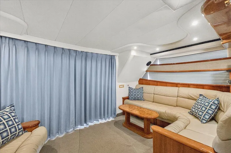 Slide: The Image of Luxurious interior of 2004 Neptunus 56 Flybridge yacht with plush seating and elegant decor. - 31