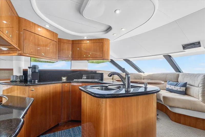 Slide: The Image of Luxurious 2004 Neptunus 56 Flybridge yacht interior with modern kitchen and plush seating. - 35