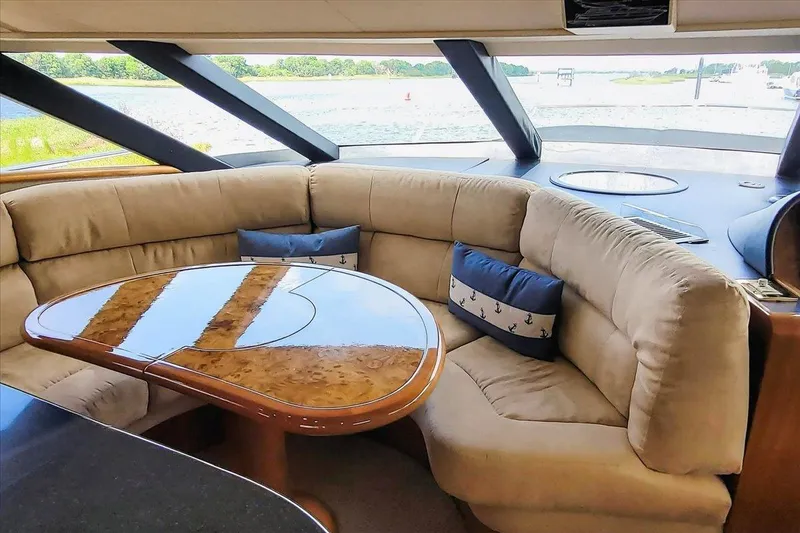 Slide: The Image of Luxurious interior of 2004 Neptunus 56 Flybridge yacht with plush seating and elegant table. - 36