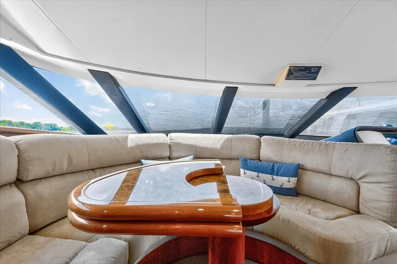 Slide: The Image of Luxurious interior of 2004 Neptunus 56 Flybridge yacht with plush seating and elegant table. - 37