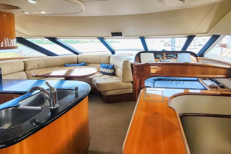 Slide: The Image of Luxurious interior of 2004 Neptunus 56 Flybridge yacht with plush seating and modern amenities. - 38
