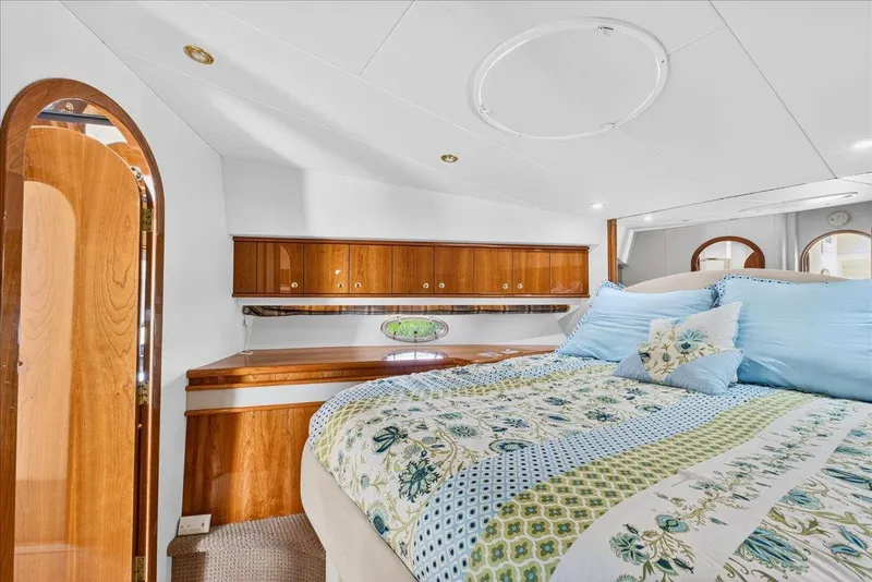 Slide: The Image of Luxurious cabin interior of 2004 Neptunus 56 Flybridge yacht with elegant wood finish. - 49