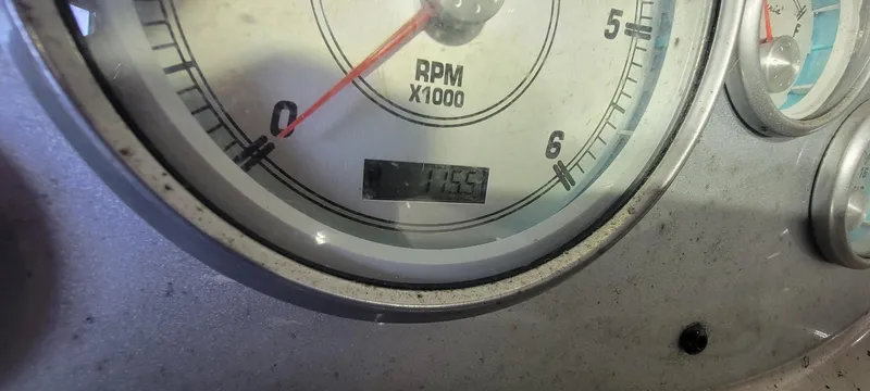 Slide: The Image of Close-up of a 2004 Maxum 2100 SC boat tachometer showing RPM and engine hours. - 4