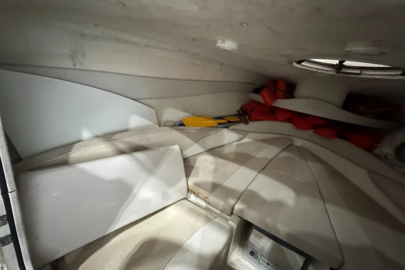 Slide: The Image of Interior of a 2004 Maxum 2100 SC boat with life jackets and paddle. - 8