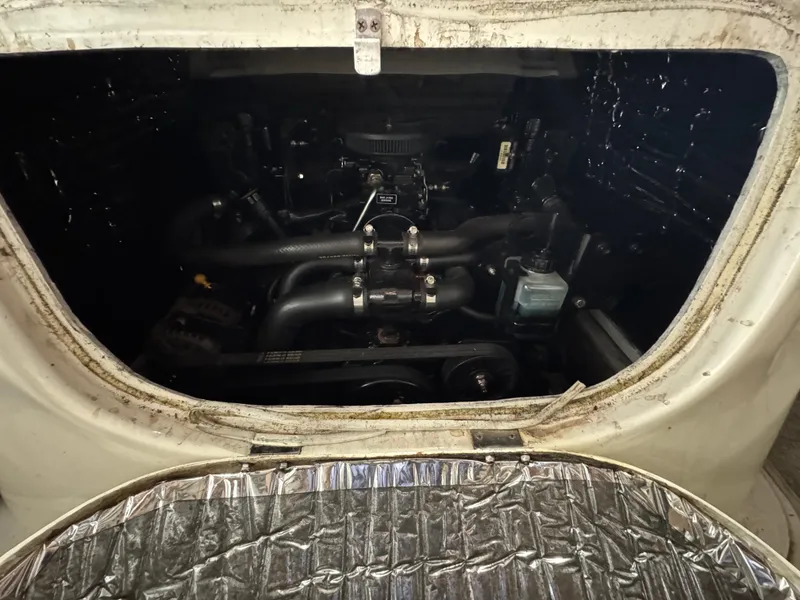 Slide: The Image of Engine compartment of a 2004 Maxum 2100 SC boat, showing mechanical components. - 9