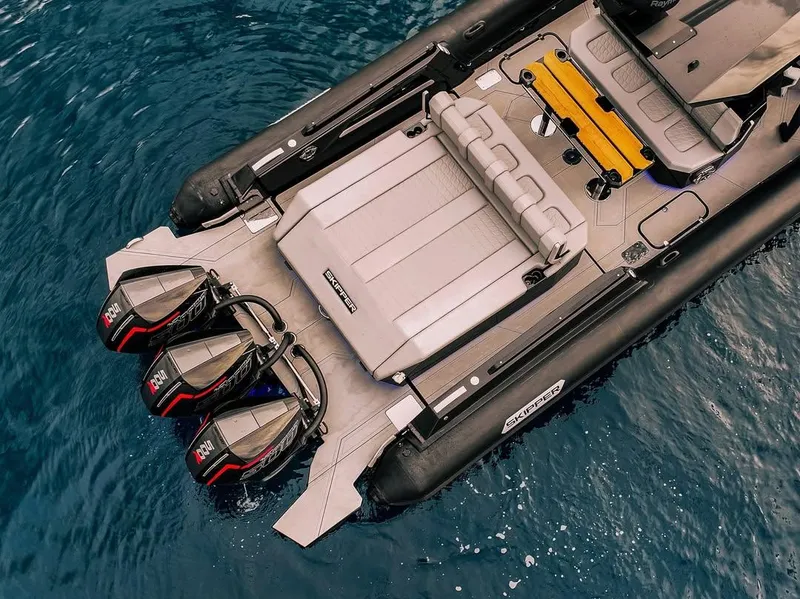 Slide: The Image of Skipper-BSK 42 boat, 2026 model, with triple outboard engines on blue water. - 7