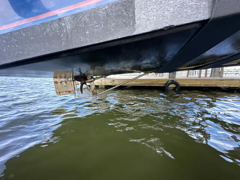 Slide: The Image of Underwater view of 2004 Jefferson Fiberglass 32 Laffite Skiff propeller near dock. - 13