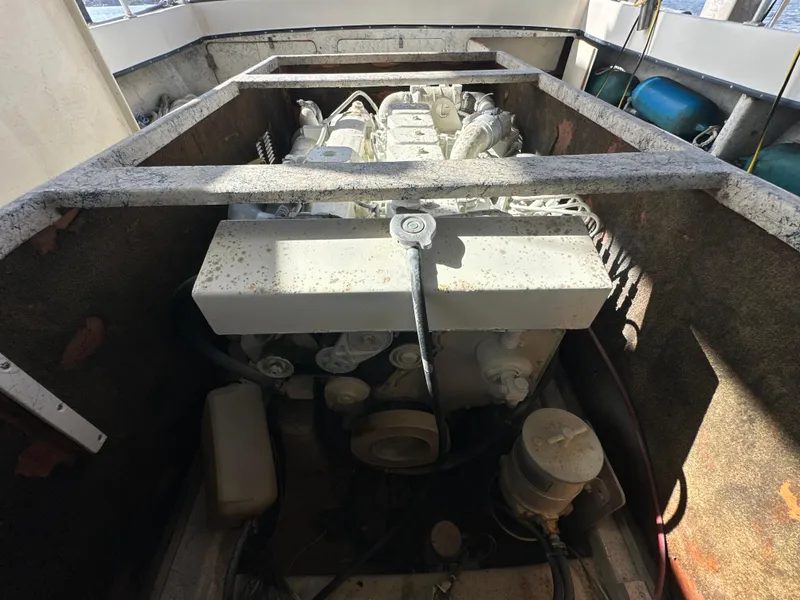 Slide: The Image of Engine compartment of a 2004 Jefferson Fiberglass 32 Laffite Skiff boat. - 16