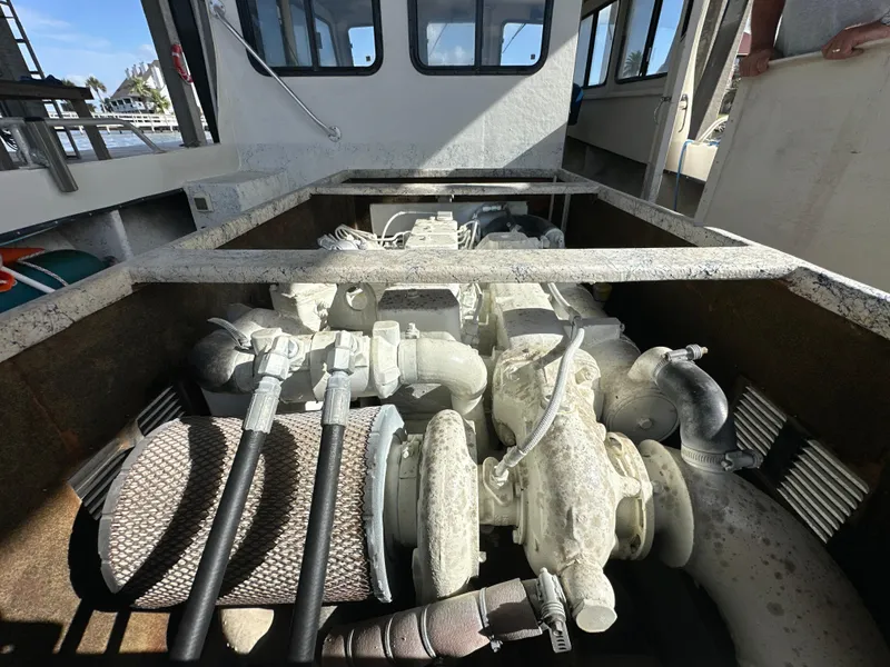 Slide: The Image of Engine compartment of a 2004 Jefferson Fiberglass 32 Laffite Skiff boat. - 18