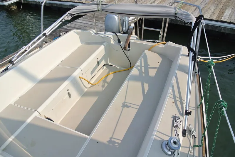 Slide: The Image of 1986 O'Day 272 sailboat cockpit with seating, docked at marina. - 10
