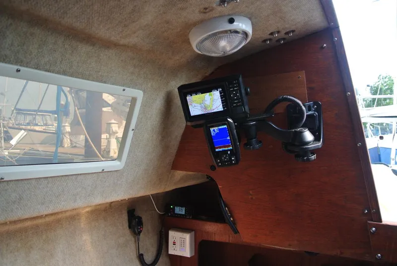 Slide: The Image of Interior of a 1986 O'Day 272 sailboat with navigation equipment. - 11