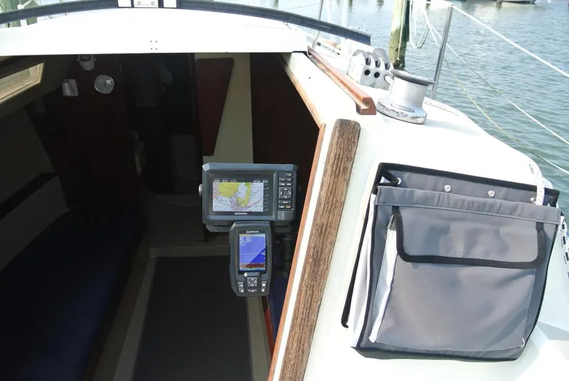 Slide: The Image of Interior view of 1986 O'Day 272 sailboat with navigation equipment and storage pouch. - 12
