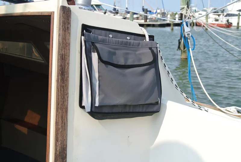 Slide: The Image of Sailboat O'Day 272 (1986) with storage bag on deck, docked at marina. - 16