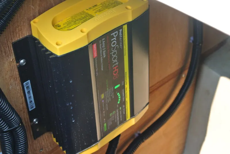 Slide: The Image of Battery charger installed on a 1986 O'Day 272 sailboat, featuring ProMariner ProSportHD8. - 21