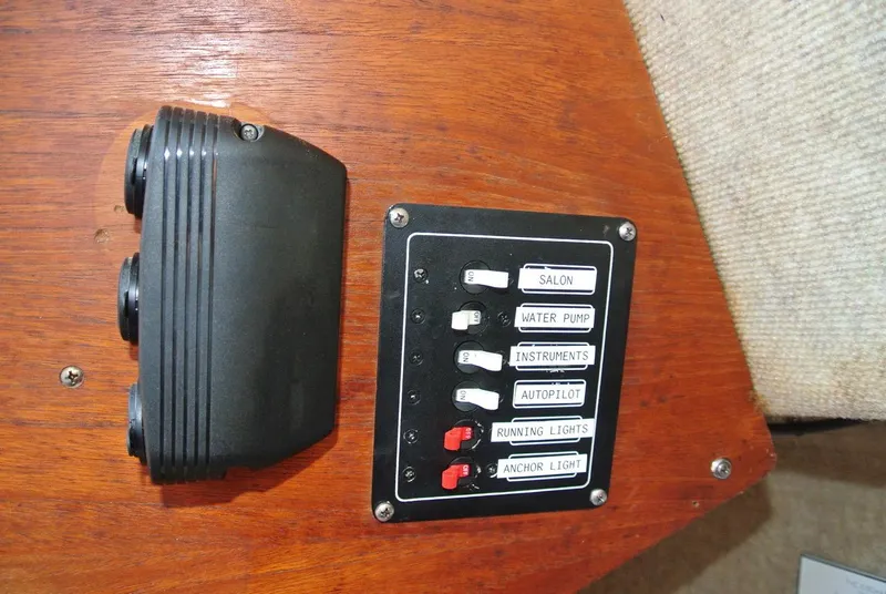 Slide: The Image of Control panel on 1986 O'Day 272 sailboat with labeled switches for various functions. - 37