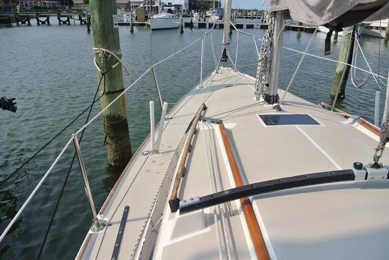 Slide: The Image of 1986 O'Day 272 sailboat docked at a marina, showing deck and rigging details. - 7