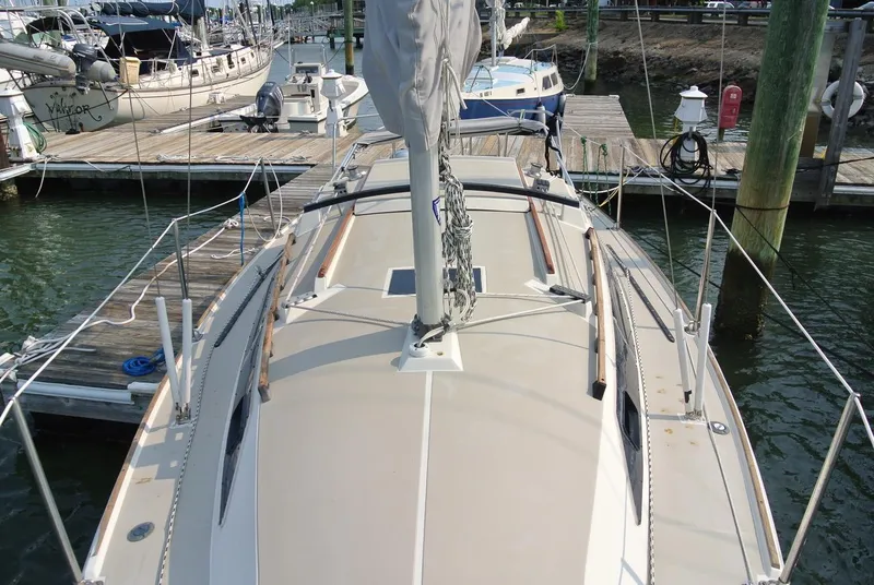 Slide: The Image of 1986 O'Day 272 sailboat docked at marina, view from deck. - 8